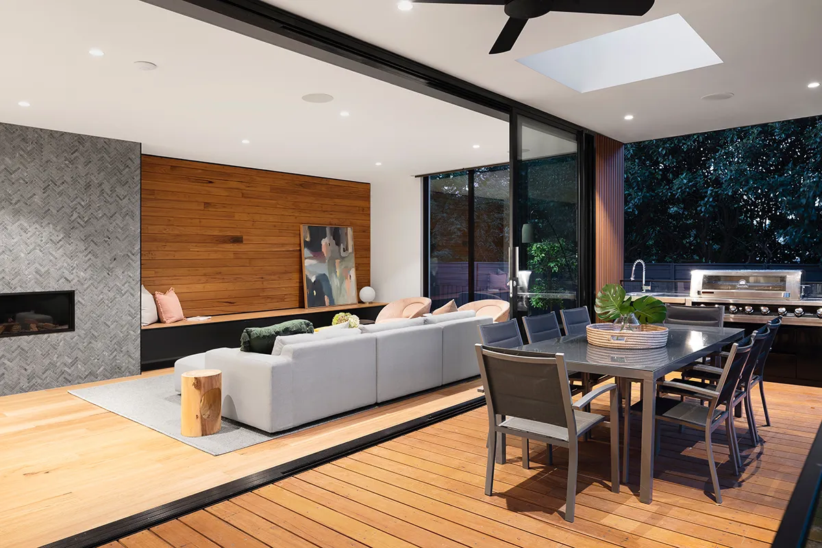 Enclosed deck coming off cosy living room, wood panelling